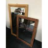 A pine framed mirror together with one other mirror