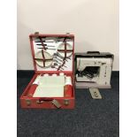 A cased vintage Elna sewing machine together with a Brexton picnic set