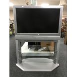 A Toshiba 32 inch lcd tv on stand with remote