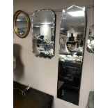 Two frameless bevelled mirrors together with an oval gilt framed mirror