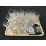 A tray of Waterford crystal glasses and a boxed Waterford desk clock.