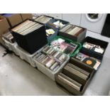 Thirteen boxes containing an extensive collection of LP's, 45's and CDs including rock,