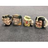 Four large Royal Doulton character jugs - The CLown, Bacchus,