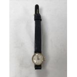 A lady's 9ct gold Longines watch on leather strap