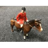 A Beswick figure - huntsman on a brown horse, model 1501,