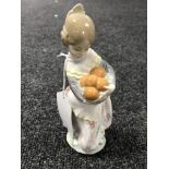 A Lladro figure - girl with basket of oranges