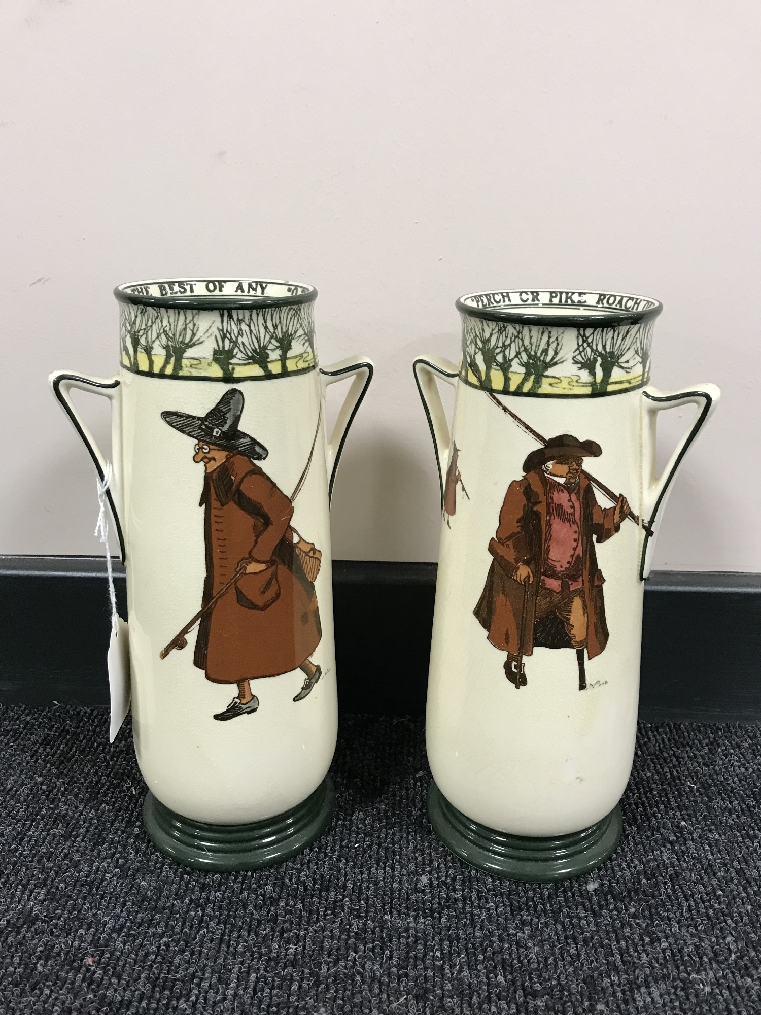 A pair of Royal Doulton Isaac Walton ware twin handled vases