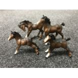 Four brown gloss Beswick standing foals (4)