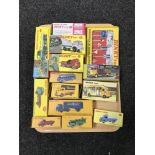 A tray of thirteen boxed Dinky die cast vehicles together with a Dinky Toys sign pack