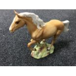 A Beswick horse - galloping horse, model 1374, palomino,