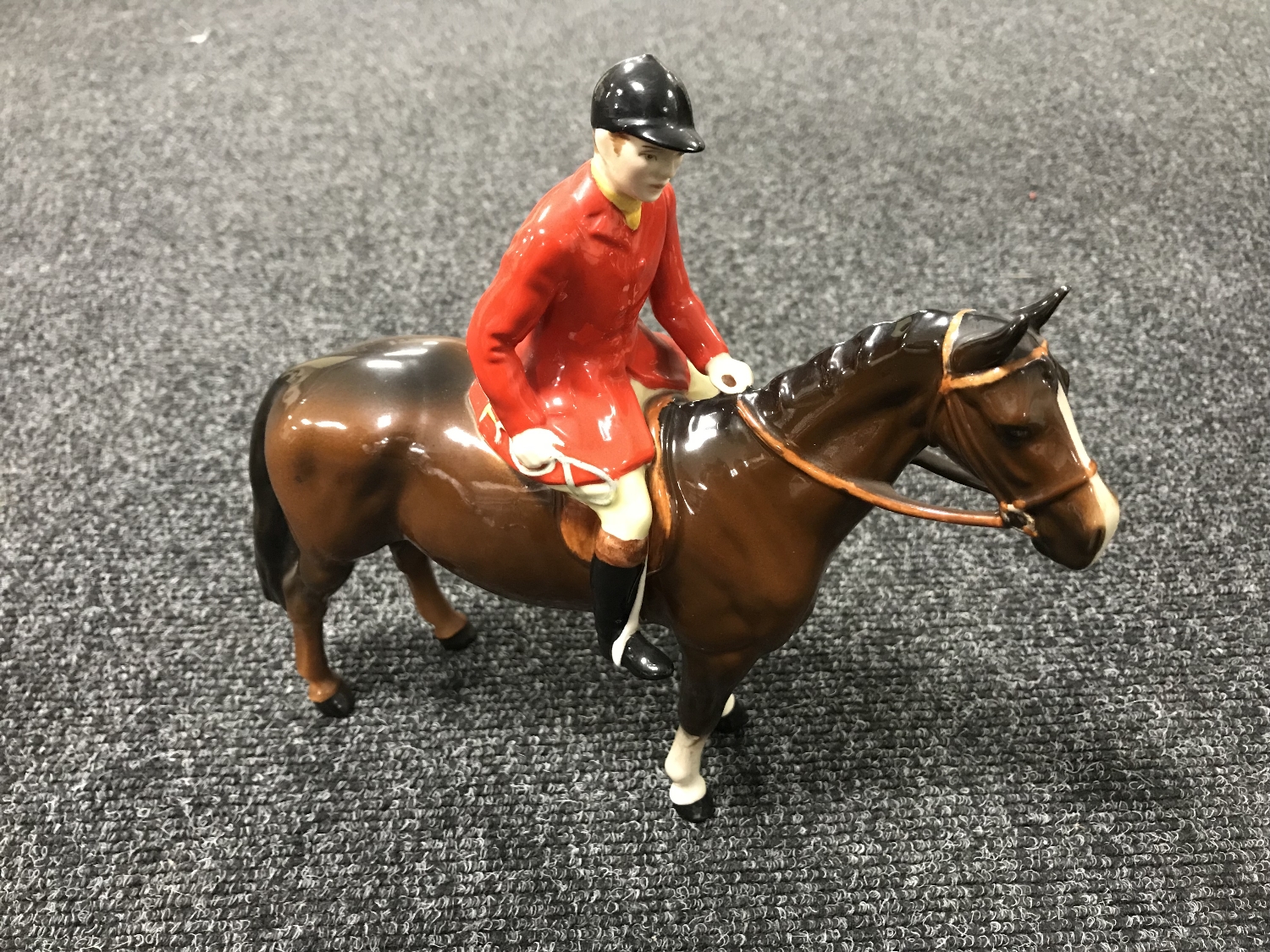 A Beswick figure - huntsman on a brown horse, model 1501,