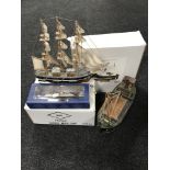 A wooden trawler part boxed, together with a wooden three masted ship,