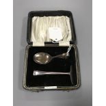 A Sterling silver cased baby spoon and pusher