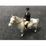 A Beswick figure - huntswoman on a horse, grey in a gloss finish.