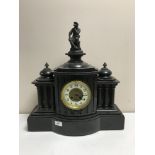 A Victorian slate mantle clock with gilt and enamel dial