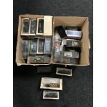 Two boxes of die cast military vehicles,