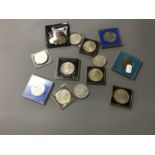 A quantity of assorted crowns, Guernsey £5 coin,