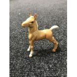 A Beswick figure - model 763 foal (small), stretched, upright, third version, palomino,