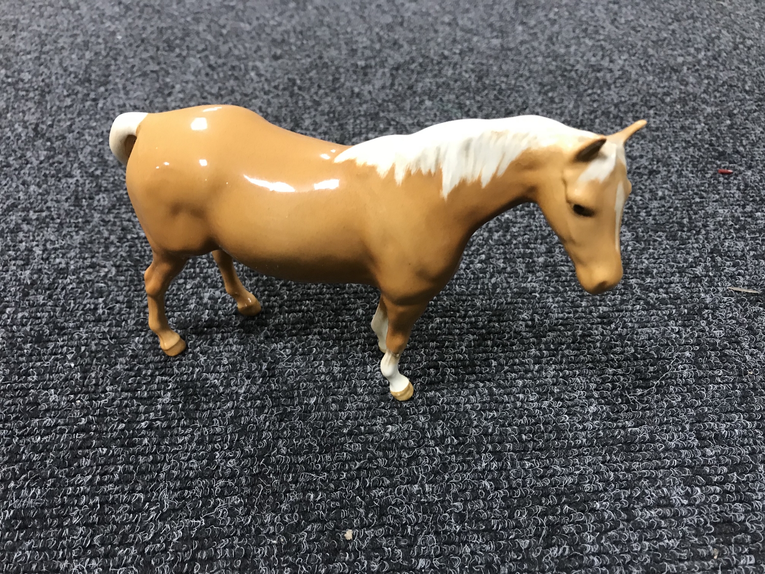 A Beswick figure - Model 1991 Mare (facing right, head up), palomino,