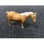 A Beswick figure - Model 1991 Mare (facing right, head up), palomino,