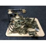 A tray of brass candlesticks in the form of Griffons, brass two-way wall scones,