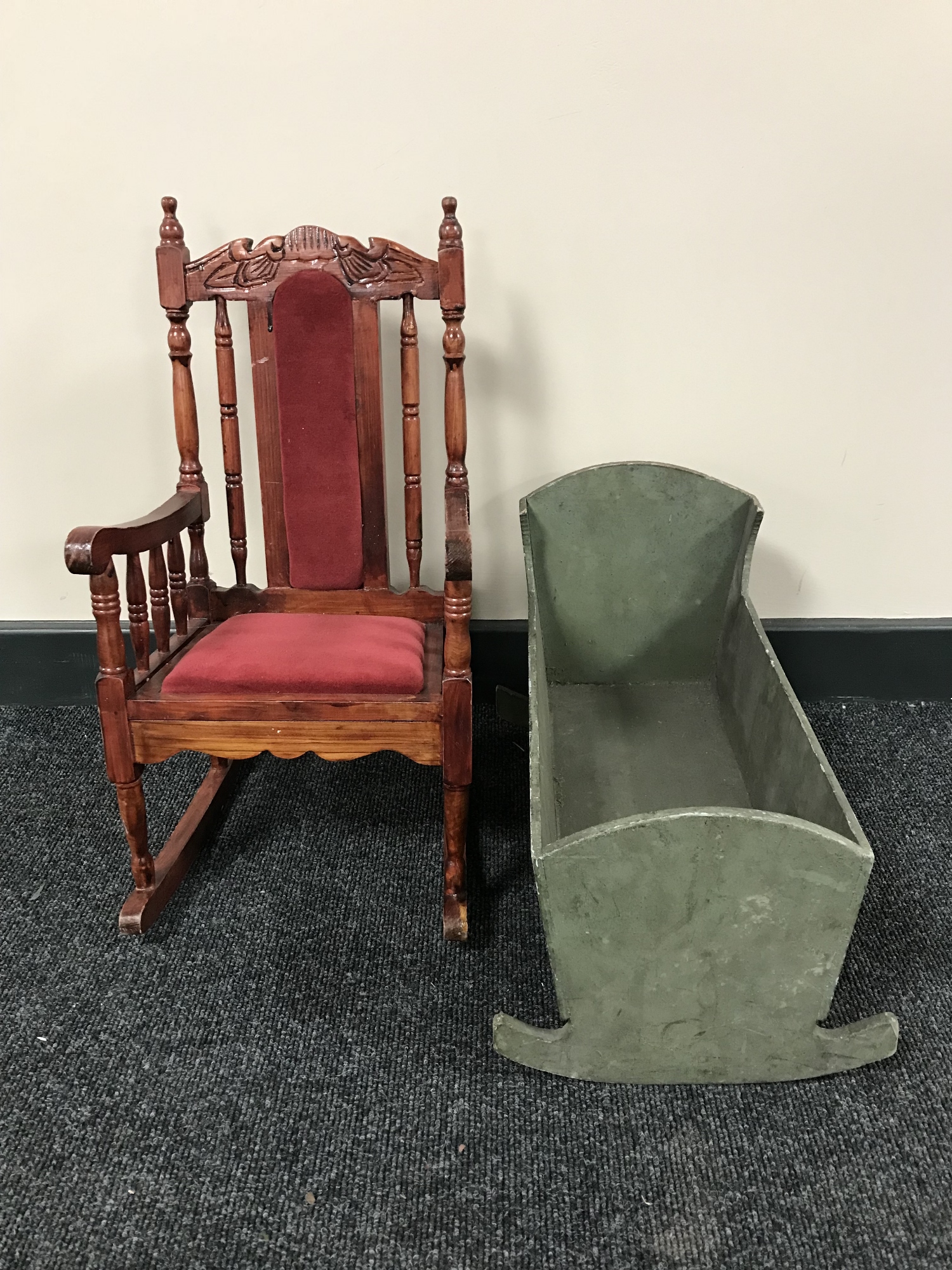 A miniature doll's rocking chair and a miniature crib