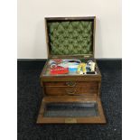 A Victorian rosewood sewing box fitted with two drawers