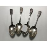 A set of four silver serving spoons