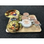 A tray of nine piece Poole pottery tea for two together with four pieces of gilded hand painted