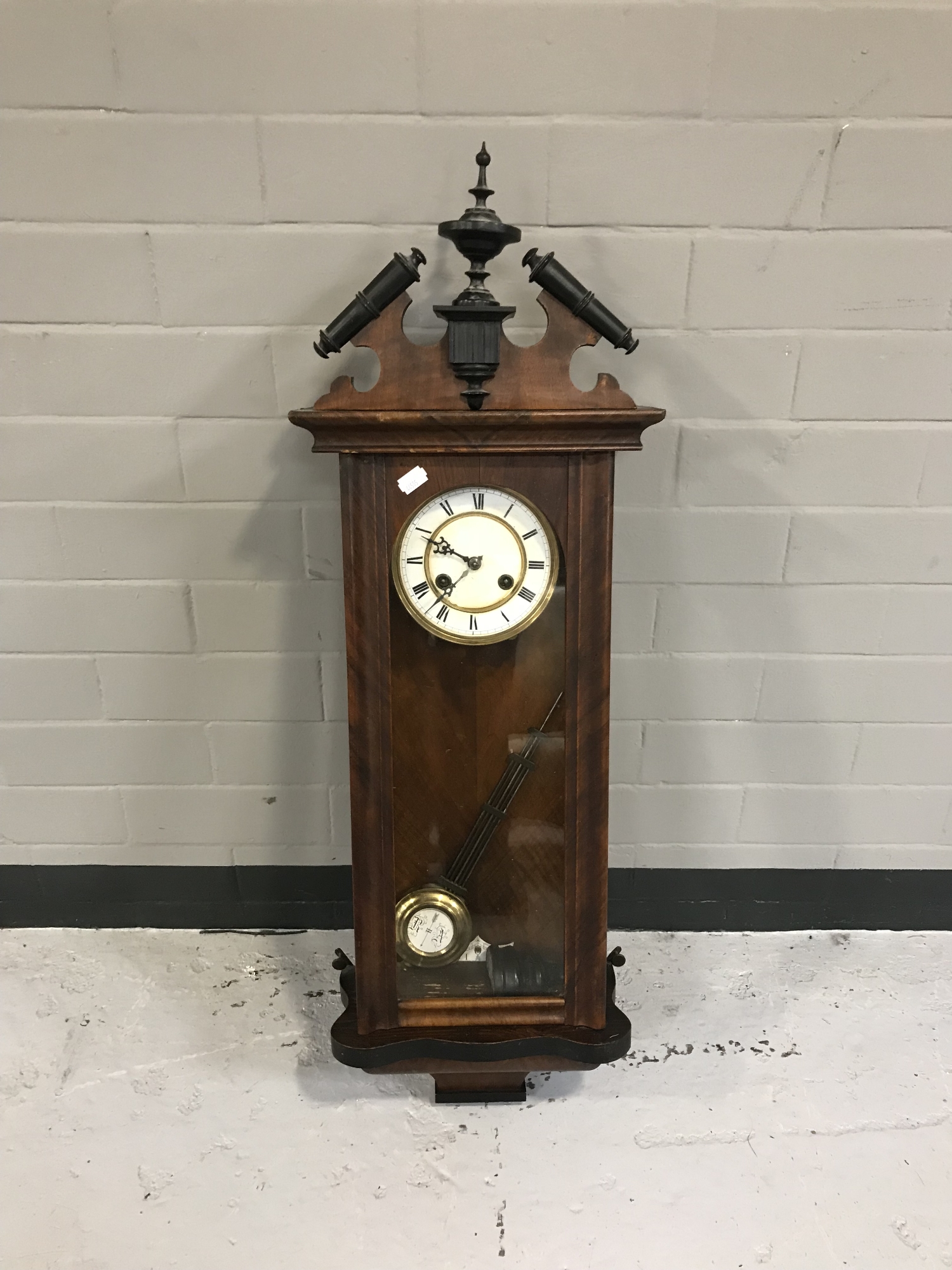 A mahogany cased eight day wall clock with enamelled dial