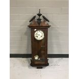 A mahogany cased eight day wall clock with enamelled dial