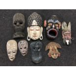 A box of carved wall masks