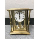 A brass cased German anniversary clock