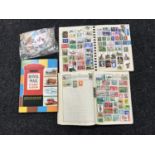 Three stamp albums with stamps and a quantity of loose stamps