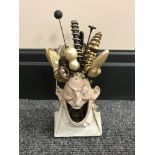 A continental bisque hat pin stand modelled after a man with an open mouth,