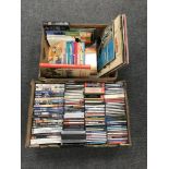A box containing assorted DVD's and CD's together with a further box containing LP's, Tin Tin books,