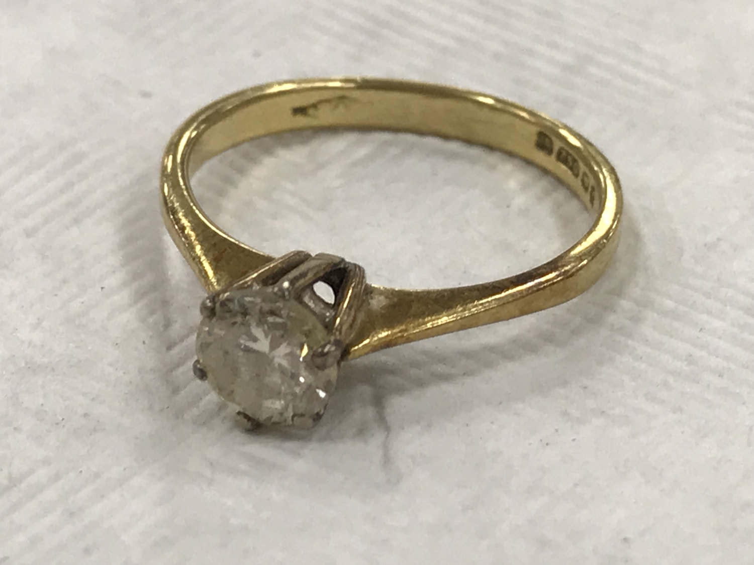 An 18ct gold diamond solitaire ring, approximately 0.