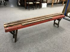 A mid 20th century folding bench together with a tapestry frame