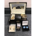 A box of vintage costume jewellery including earrings, cufflinks,