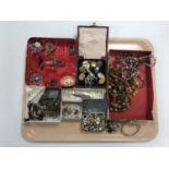 A tray containing a large quantity of costume jewellery including necklaces, brooches, buttons etc.