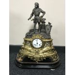 A French brass and spelter mantel clock with enamelled dial on wooden plinth