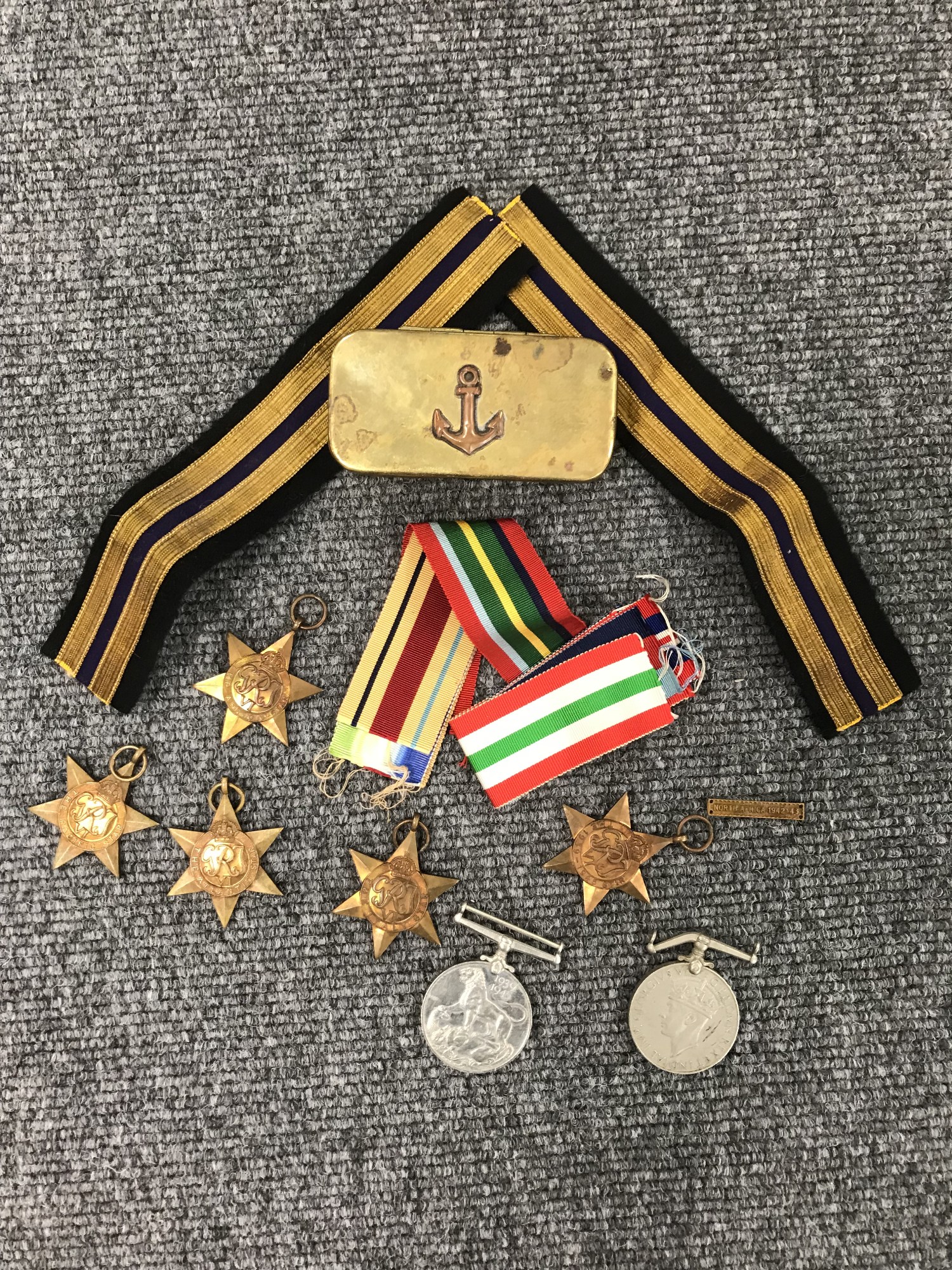 A collection of seven Second World War medals with ribbons including Italy star, Atlantic star,