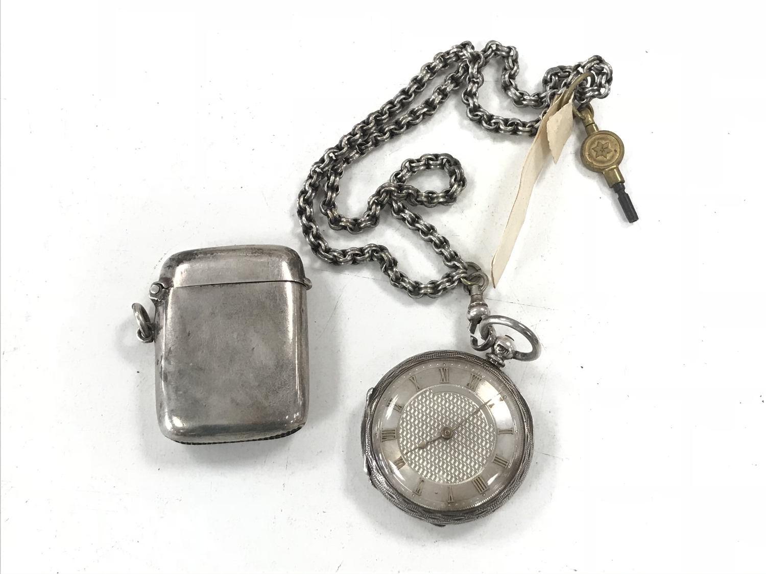 A silver cased J W Benson key wound fob watch on a chain together with a silver vesta