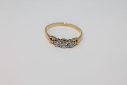 An 18ct gold three stone diamond ring, total diamond weight estimated at 0.