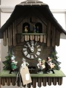 A German cuckoo clock with pendulum and weights CONDITION REPORT: The chime