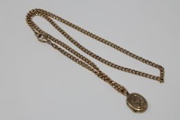 A locket upon 9ct gold chain