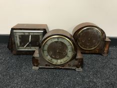 A tray of three walnut cased mantel clocks