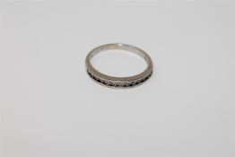 An 18ct gold diamond half eternity ring