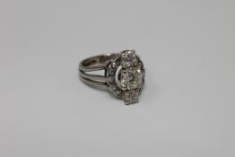 A platinum and diamond ring,