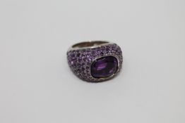 An 18ct white gold and amethyst cluster ring, 16.